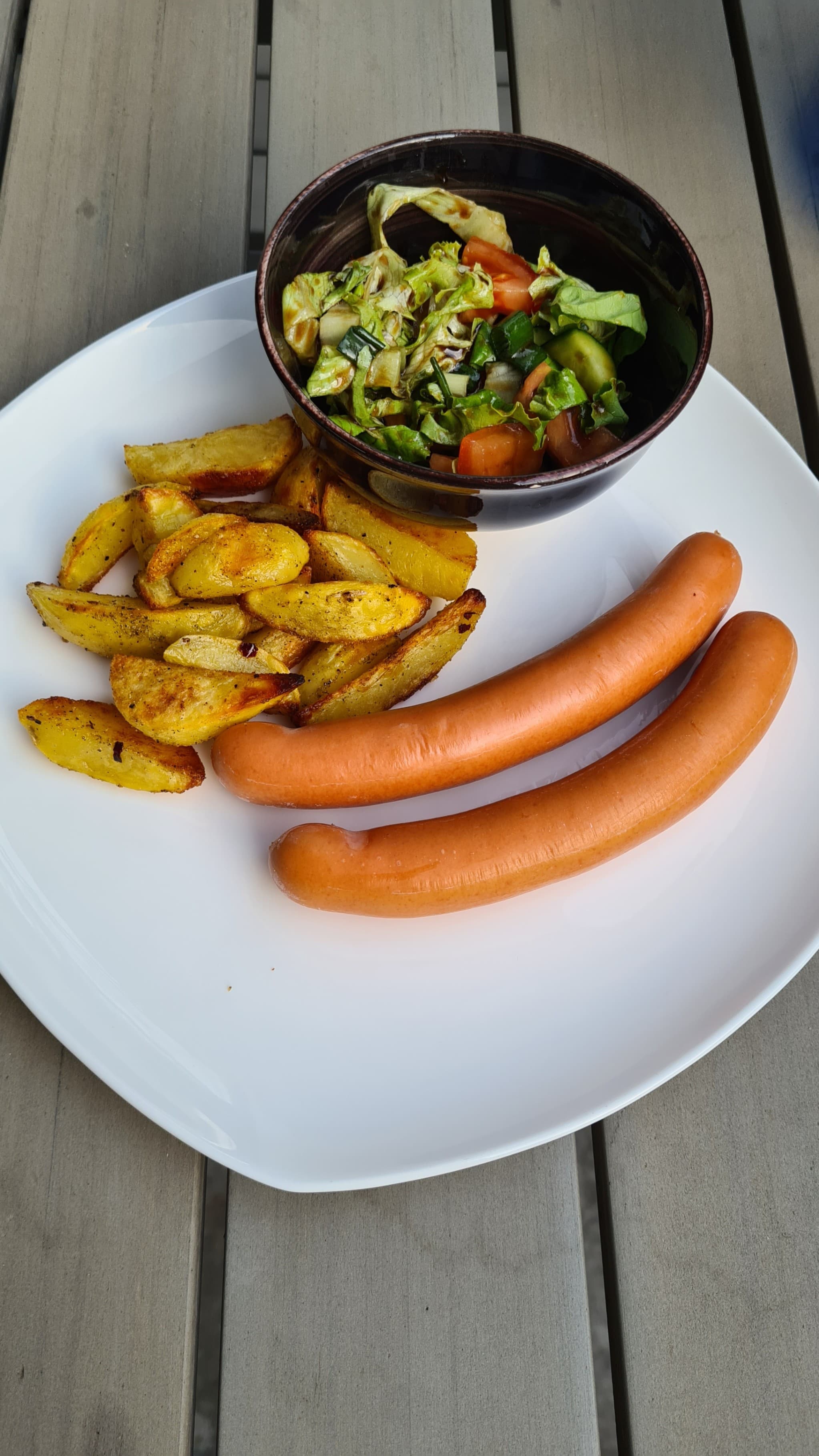 Sausages with Baked Potatoes and Fresh SaladRecipe Image